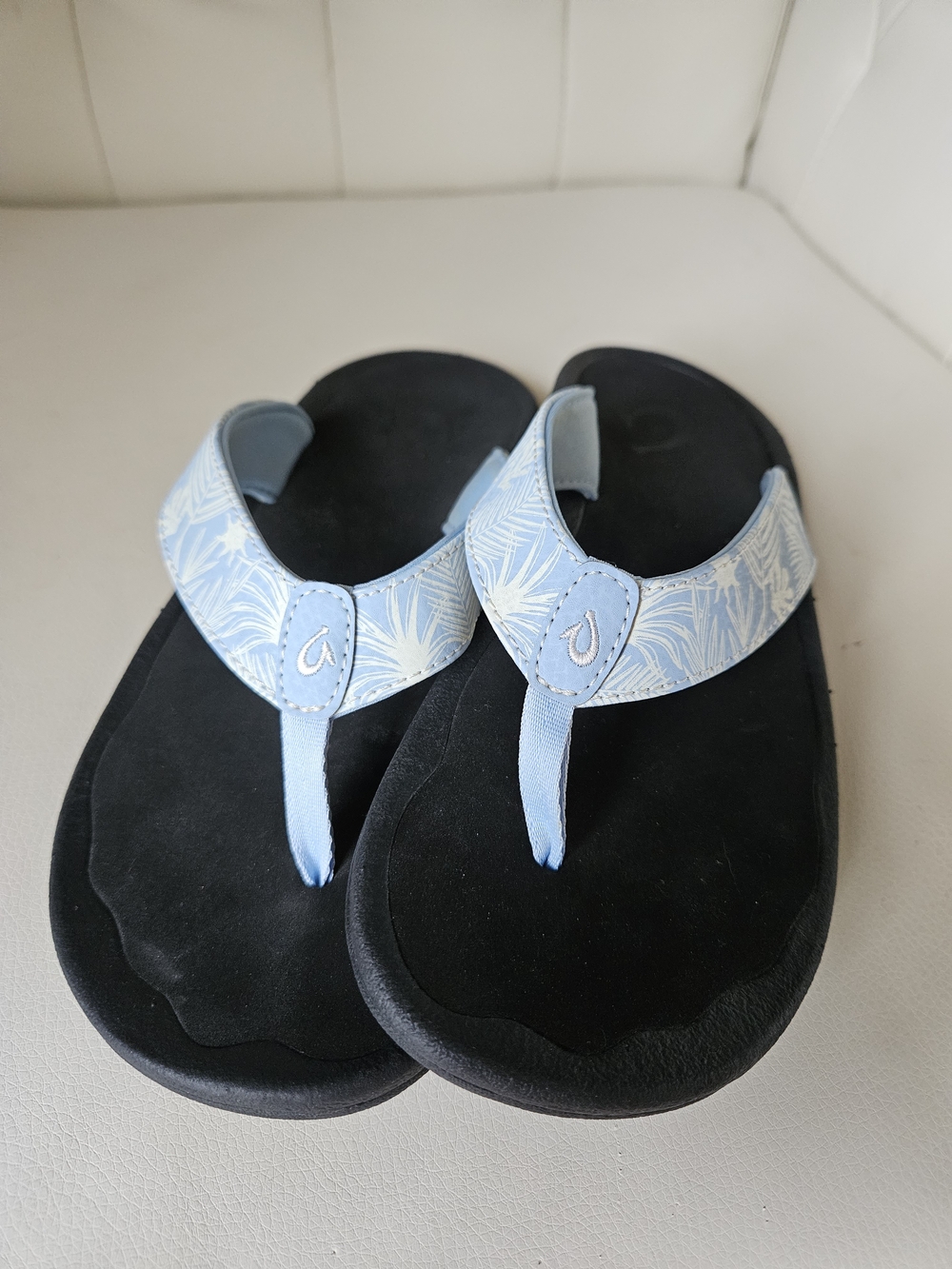 OluKai Light Blue Patterned Thong Sandals with Black Footbed